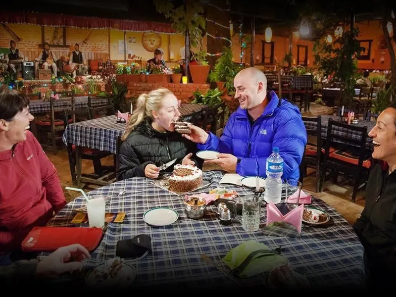 Friends laughing around the table